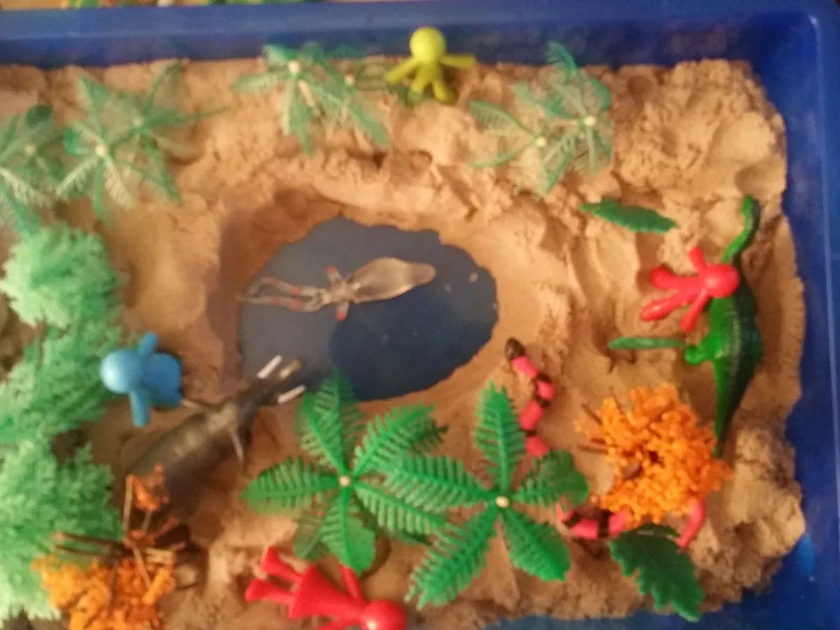 A completed sand tray arrangement from a therapy session